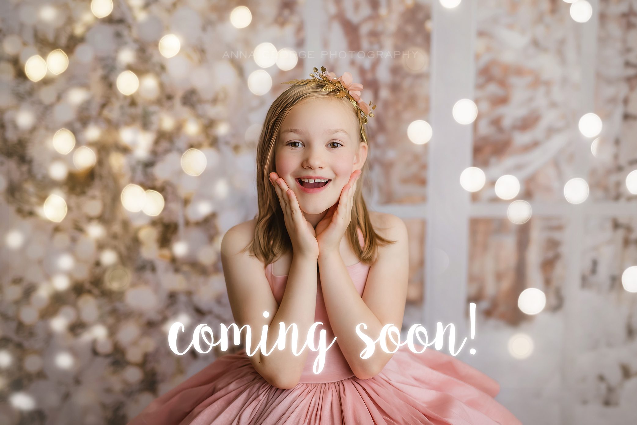 girl in pink dress on white christmas backdrop with lights, holiday mini session in madison wi studio