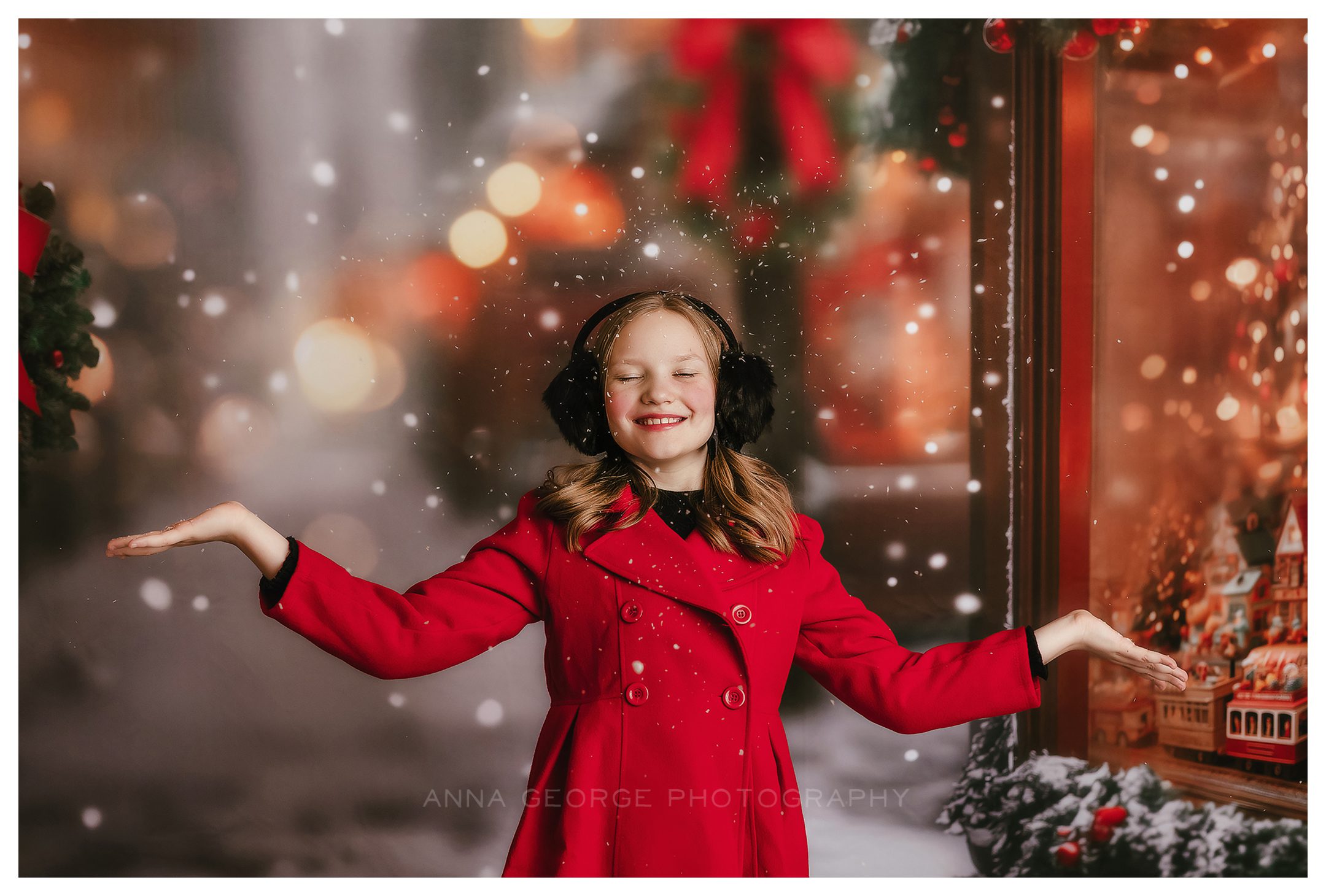 Madison WI holiday mini session example from Anna George Photography - girl in red coat on snowy street backdrop
