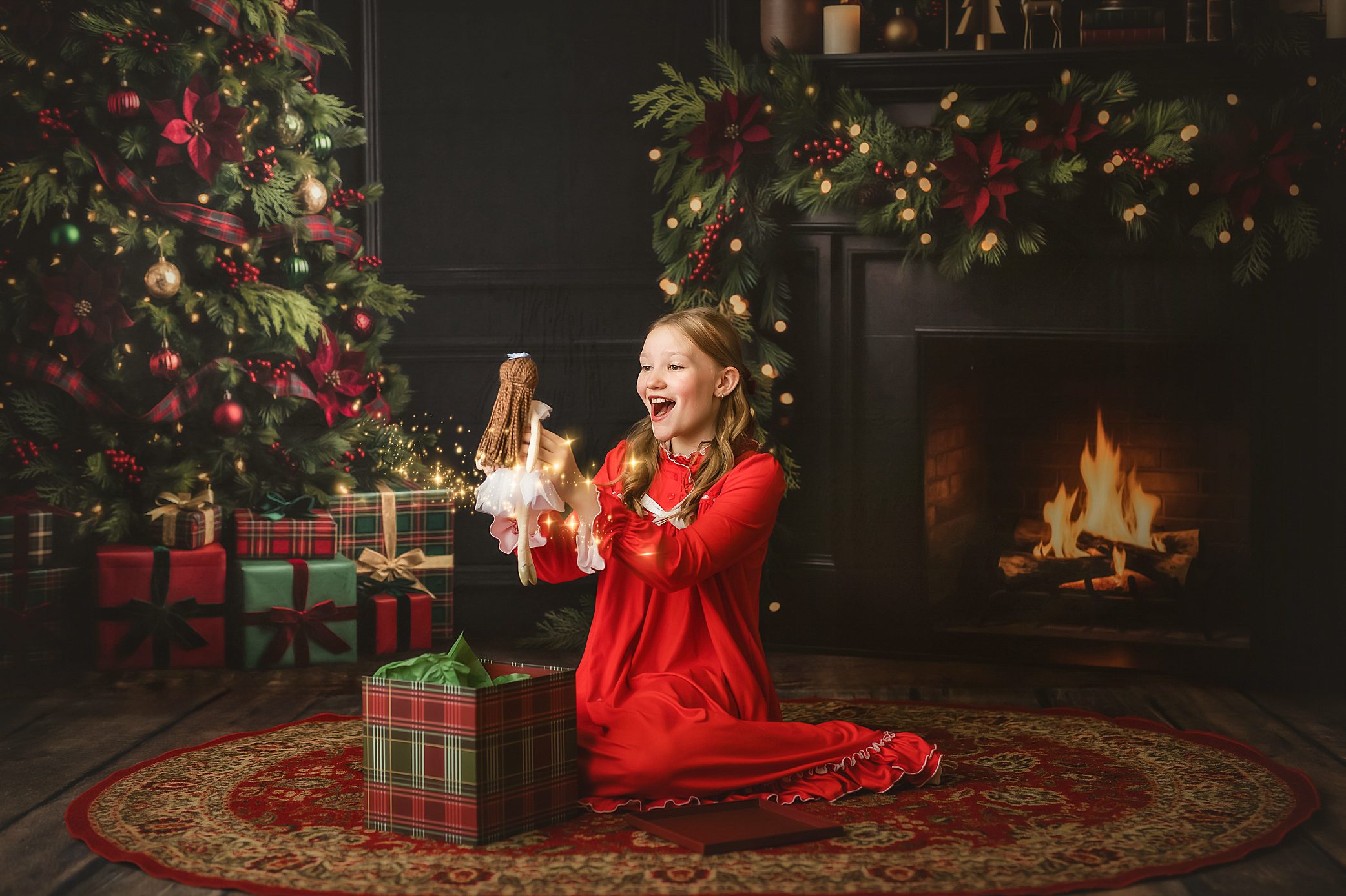girl opens present holiday photo session in studio